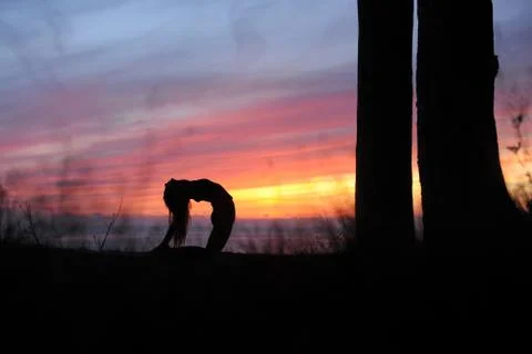 Yoga pose in the first light Stock Photos