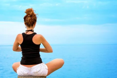 Yoga pose on seaside. Stock Photos