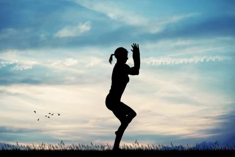 Yoga pose at sunset Stock Illustration