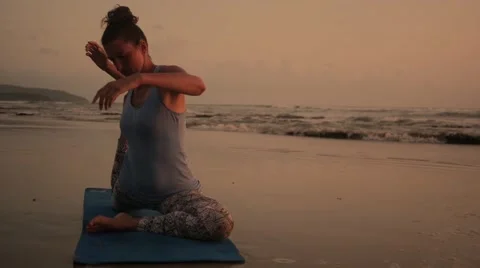 Yoga position by ocean in slow motion Stock Footage 60952428
