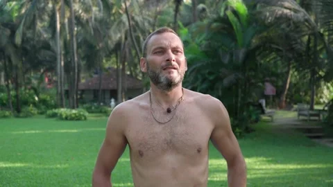 Yoga practice. Man doing exercises to improve his health 動画素材 168920291