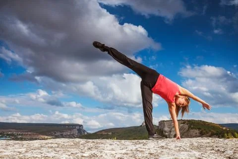Yoga practice in mountain Stock Photos
