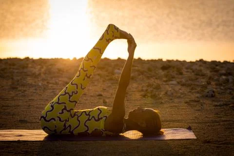 Yoga practice at sunrise Stock-Fotos