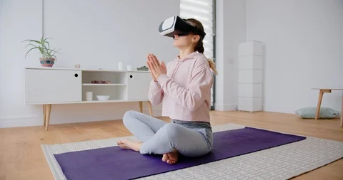 Yoga practicing with Virtual Reality set Stock Footage 122235404