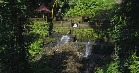 Yoga practicing at waterfall Stock Footage 92966844