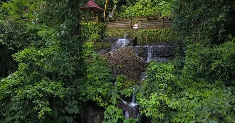 Yoga practicing at waterfall Stock Footage 92972094