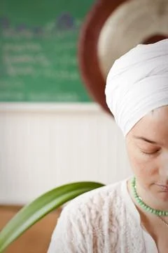 A yoga practicioner meditates at a studio in Ashland, Wisconsin. Stock Photos