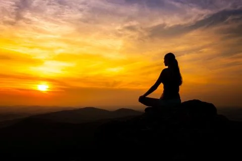 Yoga practicioner in sunset Stock Photos