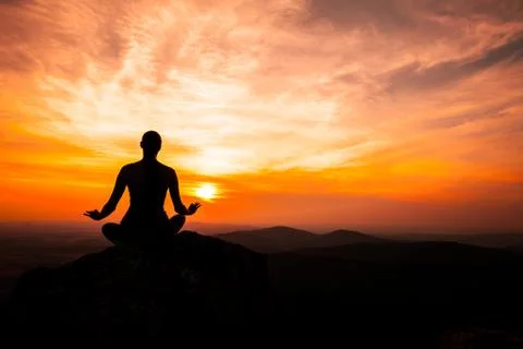 Yoga practicioner in sunset Stock Photos