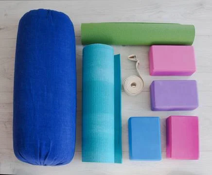 Yoga props blocks, strap, roller and carpet Stock Photos