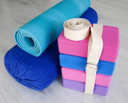 Yoga props blocks, strap, roller and carpet Stock Photos