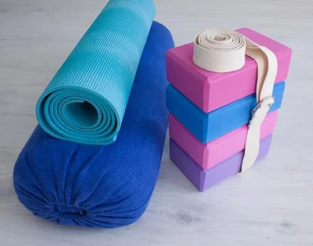 Yoga props blocks, strap, roller and carpet Stock Photos