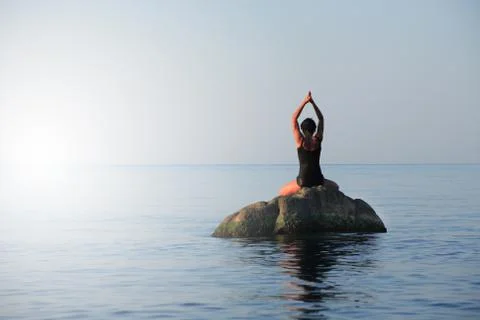 Yoga in the sea Stock Photos