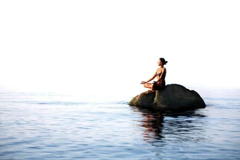 Yoga in the sea Stock Photos