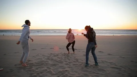 Yoga session on the beach with coach men and woman. People are dancing on the Stock-Footage 102167694