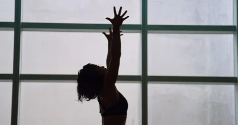 Yoga student stretches in front of window Vídeos de archivo 138034323