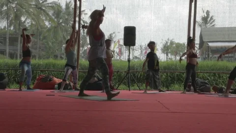 Yoga studio workshop, teacher with students, sliding shot. Stock Footage 82329126