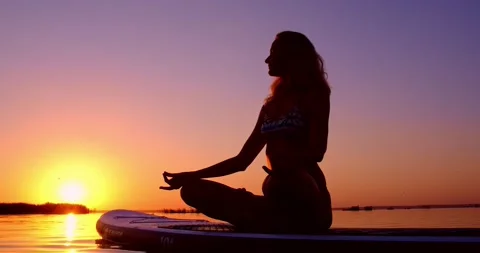 Yoga at sunset Stock Footage 136322585