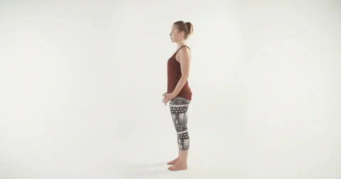 Yoga teacher demonstrating basic yoga routine on white background Stock-Footage 68295393