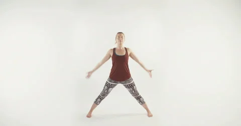 Yoga teacher demonstrating routine on white background Stock-Footage 68295328
