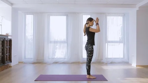 Yoga trainer executing a sequence Stock Footage 71688116