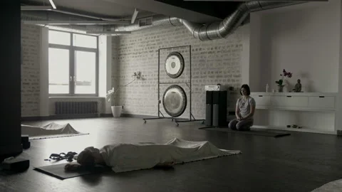 Yoga trainer is waiting until her students rest Video stock 102549282