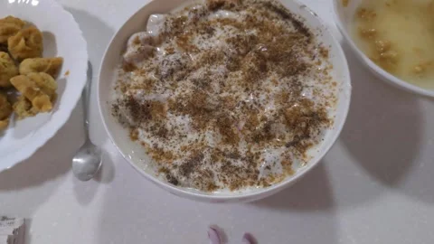 Yoghurt with black pepper served in a large bowl. Stock Footage 294943892