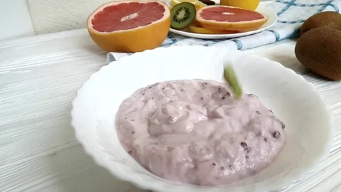 Yoghurt fruit kiwi slow motion Stock Footage 89252177