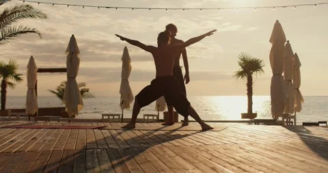 Yogi guy helps his student to take the right posture for meditation. Morning Видео 249235595
