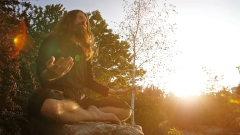 Yogi Meditating on sunset Stock Footage 81177894