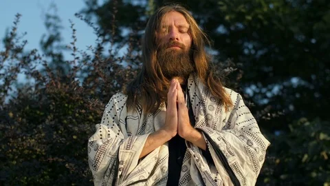 Yogi praying on nature Stock Footage 80550390