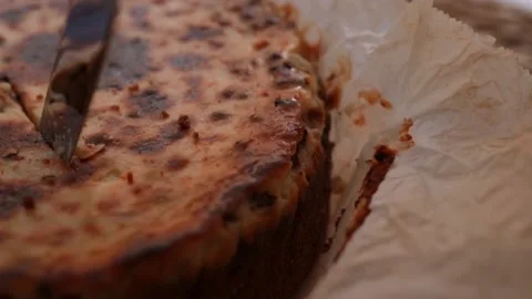 Yogurt cheesecake with chocolate chips, cutting with a cake knife Stock Footage 231408448