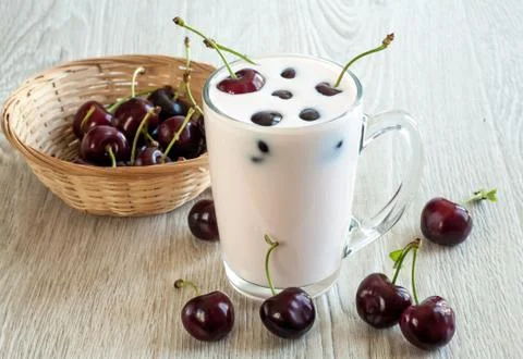Yogurt with cherries Stock Photos