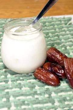 Yogurt with dates Stock Photos