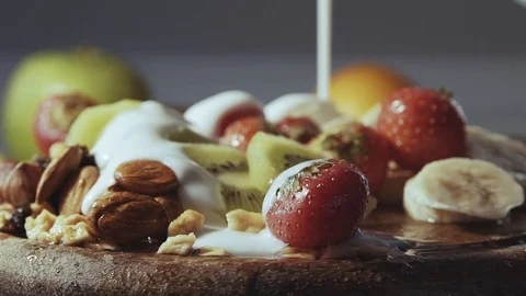 Yogurt falls on fresh fruit Stock Footage 81165488