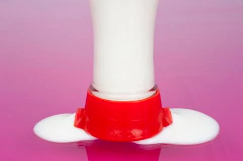 Yogurt filled bottle running empty Stock Photos