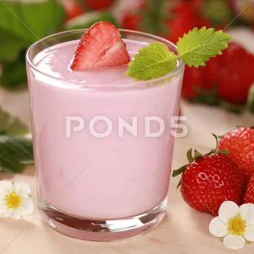 Yogurt with fresh strawberries Stock Photos
