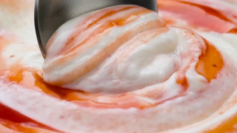 Yogurt with fruit jam in spoon, extreme close up Video stock 149320255