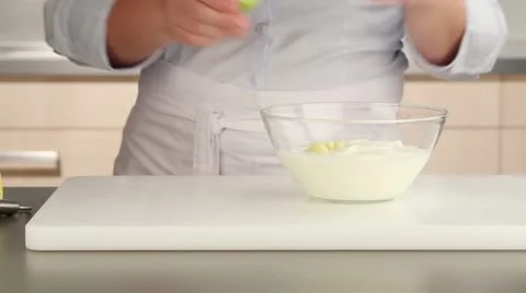 A yogurt marinade being made: lime juice being added to yogurt Video stock 24656974