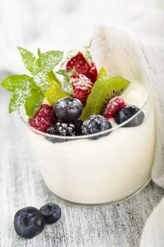 Yogurt with mint and berries. Stock Photos