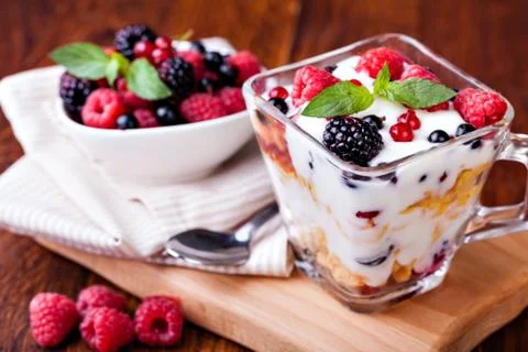 Yogurt with muesli and berries Stock Photos