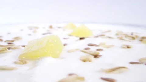 Yogurt with nuts and pineapples Stock Footage 141889703