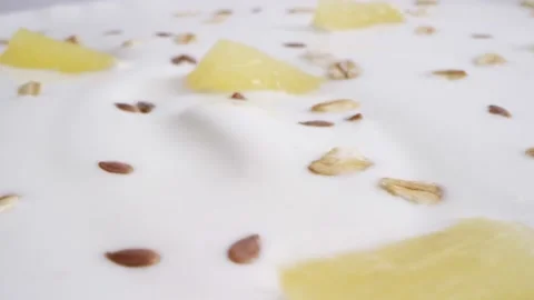 Yogurt with nuts and pineapples Stock Footage 141890011