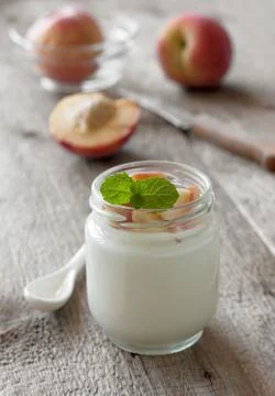 Yogurt with peach Stock Photos