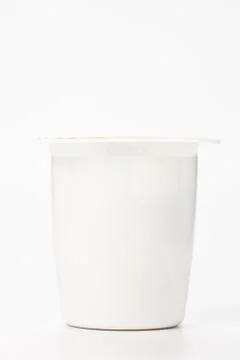 Yogurt in plastic box container over white background Stock-Fotos