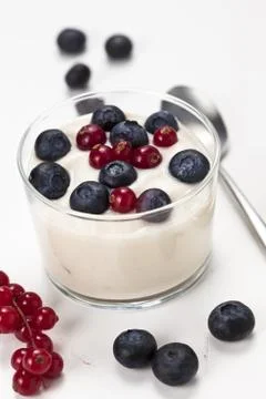 Yogurt in plastic box container over white background Stock Photos