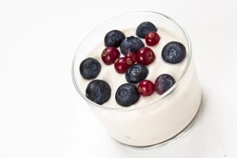 Yogurt in plastic box container over white background Stock Photos
