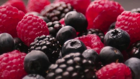 Yogurt is poured on the berries Stock Footage 161184160