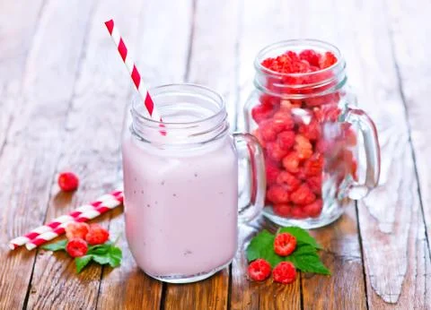 Yogurt with raspberry on a table Stock Photos