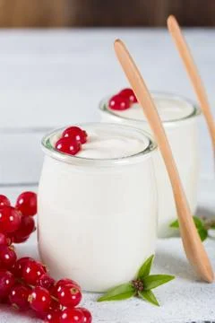 Yogurt with red currant Stock Photos